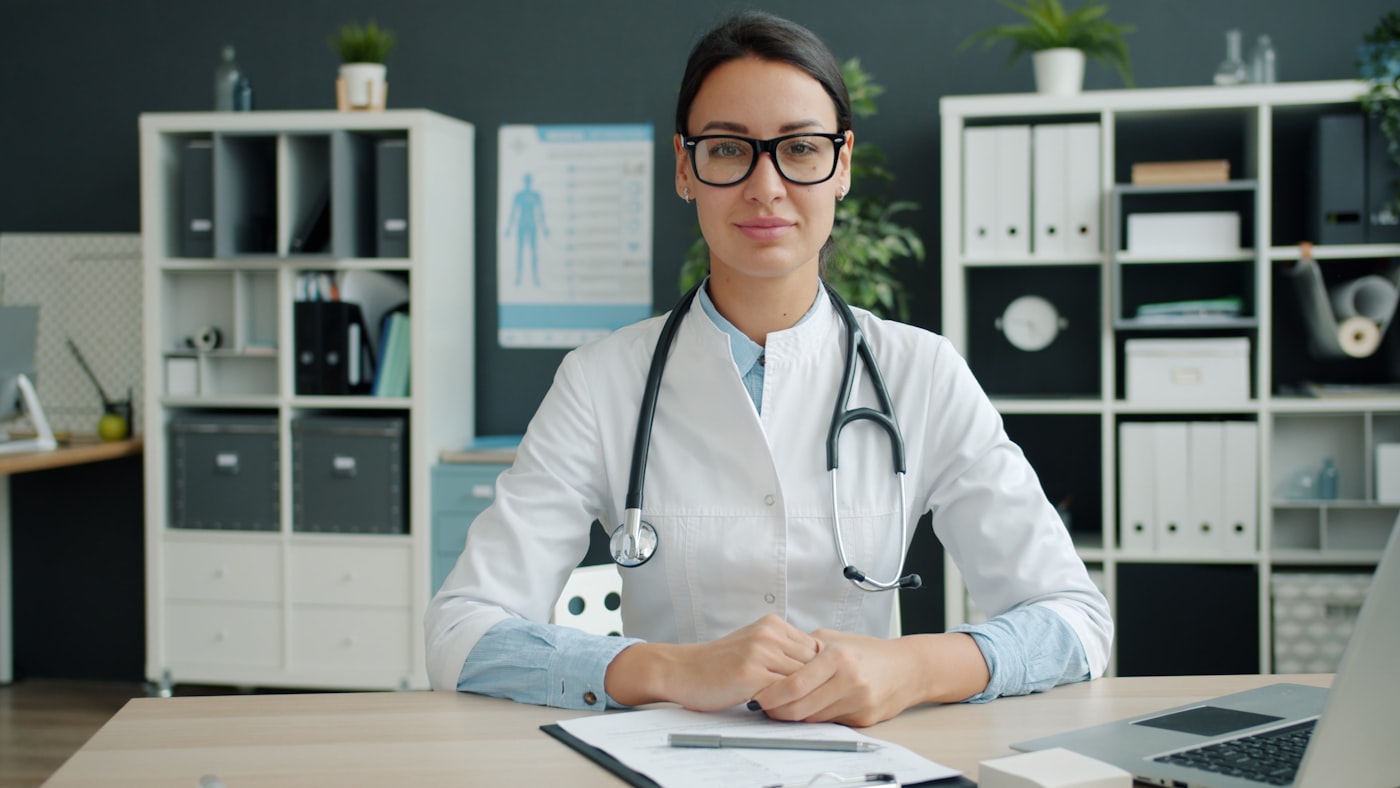 Dr. Rachel Bennett, MD, Board Certified in Endocrinology, in a white coat