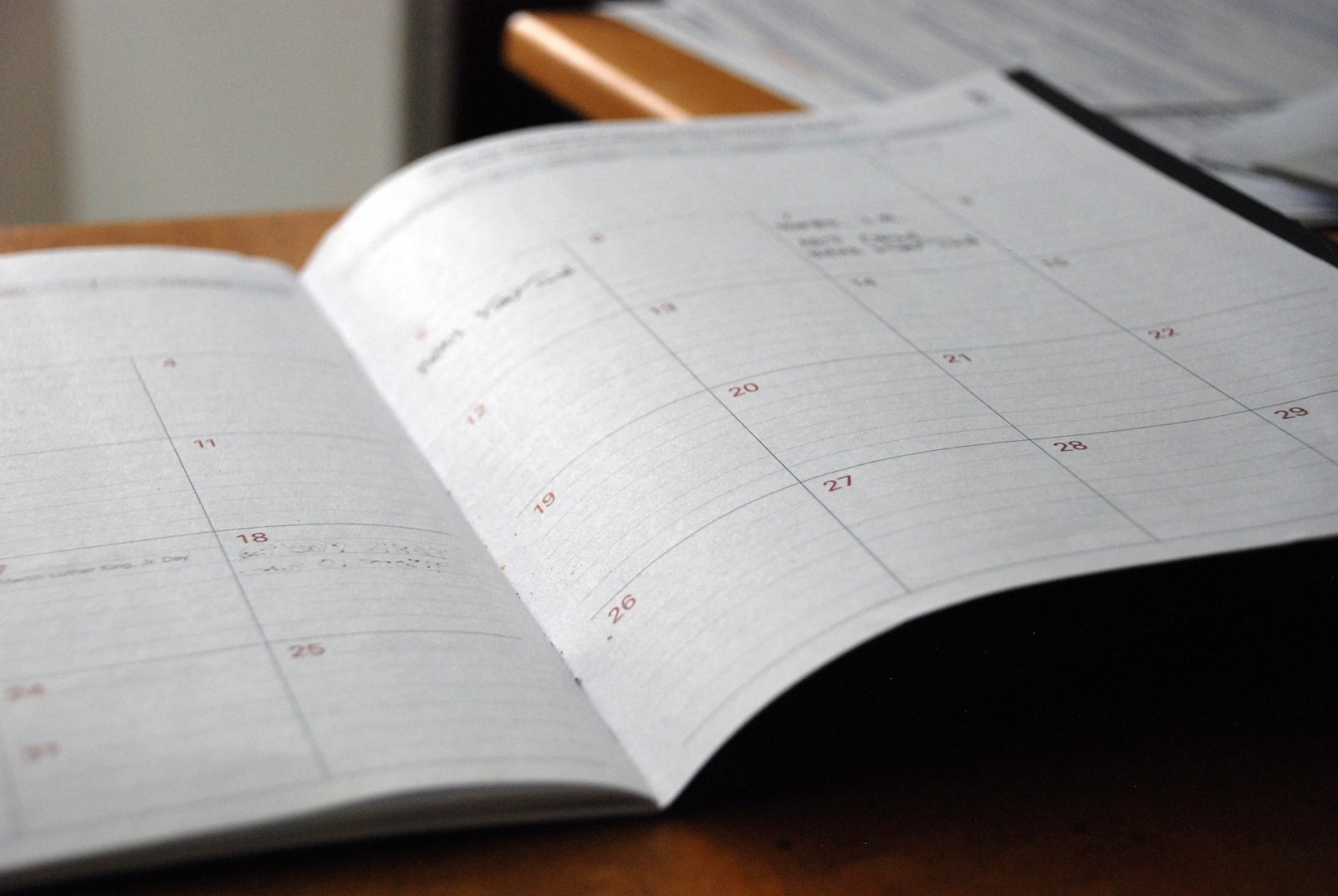 Desk calendar and appointment card on a clinic reception counter